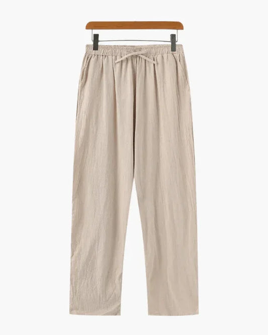 Beige linen drawstring pants with elastic waist on hanger, minimalist style
