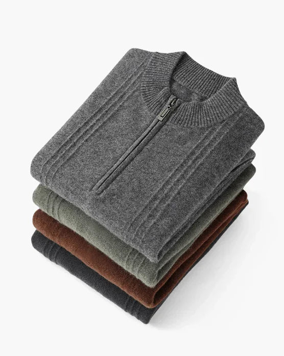 Stack of folded men's knit quarter-zip sweaters in gray, green, brown, and black