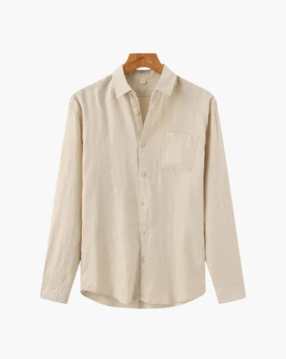 Beige long sleeve button-up shirt with chest pocket on wooden hanger